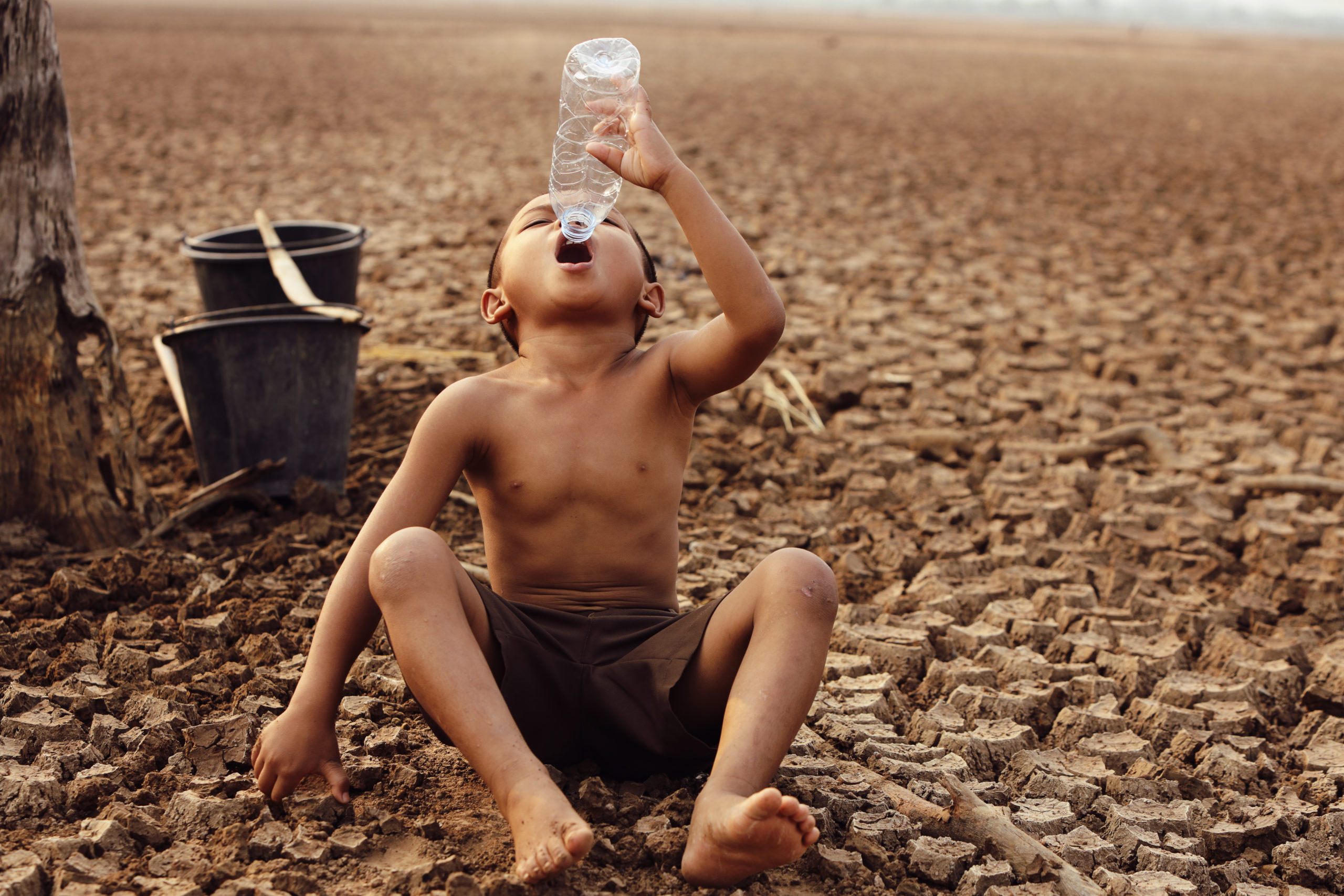 Asian Boys Are Currently Lacking Clean Water For Consumption 