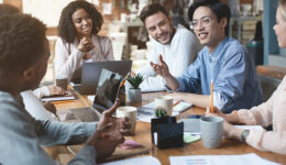 Close up of young people having business meeting in office
