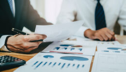 financial advisory services. Asian advisor showing plan of inves