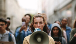 People on strike protesting with megaphone