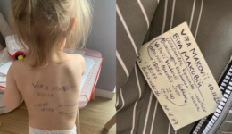 Mãe ucraniana escreve nas costas da filha com medo de perdê-la em fuga