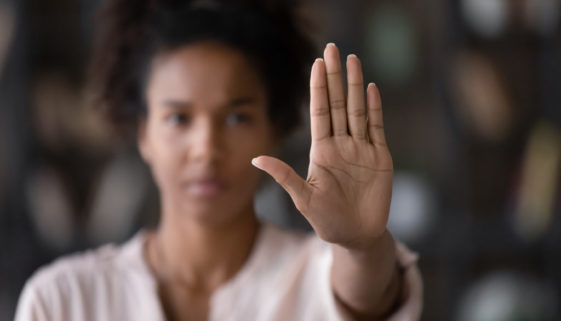 Close up African American woman showing stop gesture with hand
