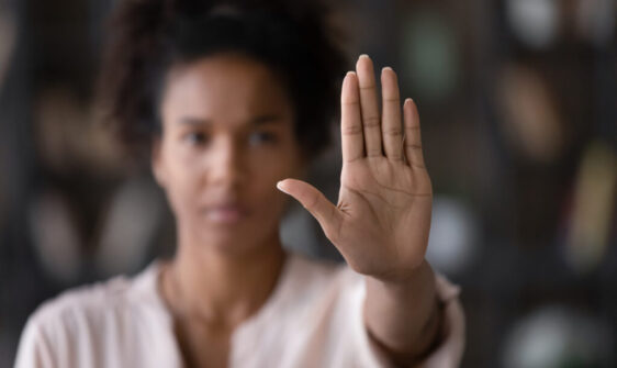 Close up African American woman showing stop gesture with hand