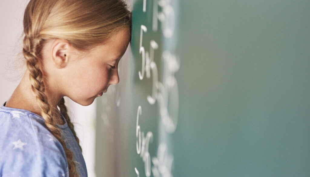 Schoolgirl trying to understand formula