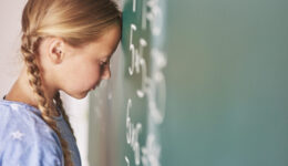 Schoolgirl trying to understand formula