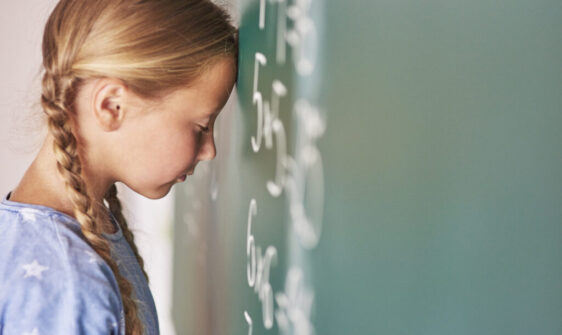 Schoolgirl trying to understand formula